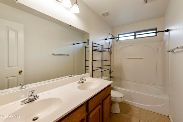 full bathroom featuring toilet, vanity,  shower combination, and tile patterned floors