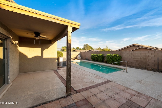 view of pool with ceiling fan and a patio area