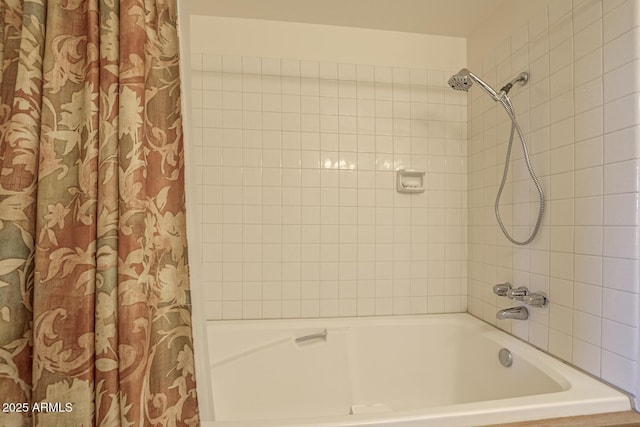 bathroom featuring shower / bathtub combination with curtain