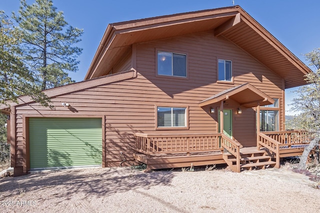 back of house featuring a garage