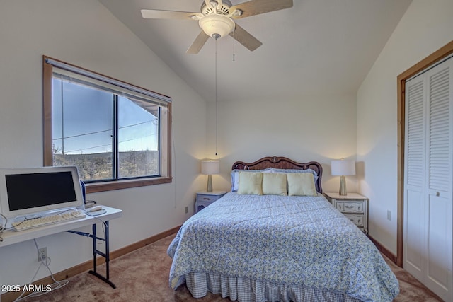 carpeted bedroom featuring ceiling fan, vaulted ceiling, and a closet