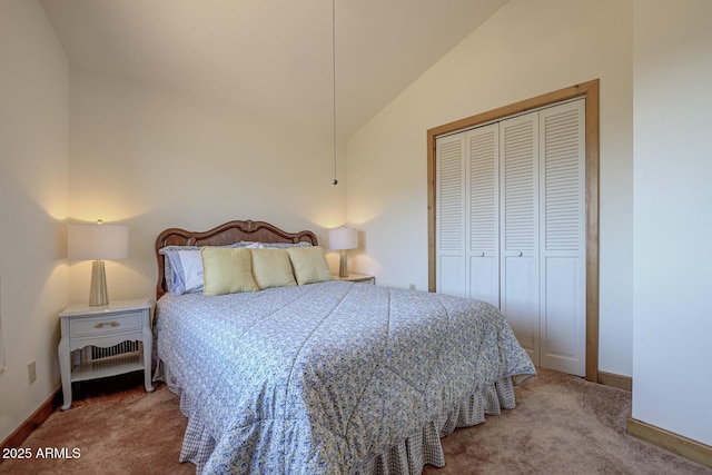 carpeted bedroom with lofted ceiling and a closet