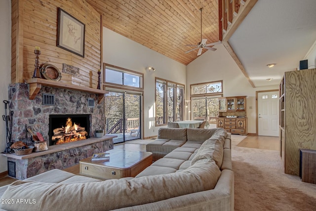 living room featuring light colored carpet, a fireplace, high vaulted ceiling, and wooden ceiling