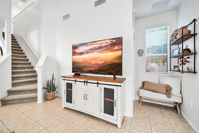 living room with light tile patterned floors