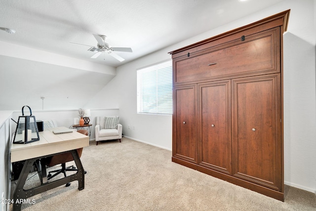 office with vaulted ceiling, light colored carpet, and ceiling fan