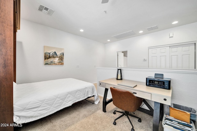 bedroom with light colored carpet