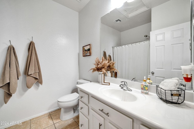 bathroom with vanity, toilet, curtained shower, and tile patterned flooring