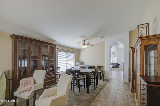 4369 E Coal St, San Tan Valley, AZ 85143 - dining area with a ceiling fan, arched walkways, healthy amount of natural light, and light tile patterned flooring