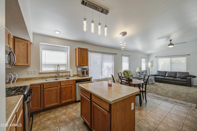 4369 E Coal St, San Tan Valley, AZ 85143 - kitchen featuring stainless steel appliances, light tile patterned flooring, light countertops, brown cabinets, and a ceiling fan