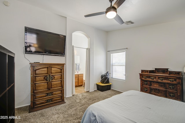 4369 E Coal St, San Tan Valley, AZ 85143 - carpeted bedroom with arched walkways, ensuite bath, and ceiling fan