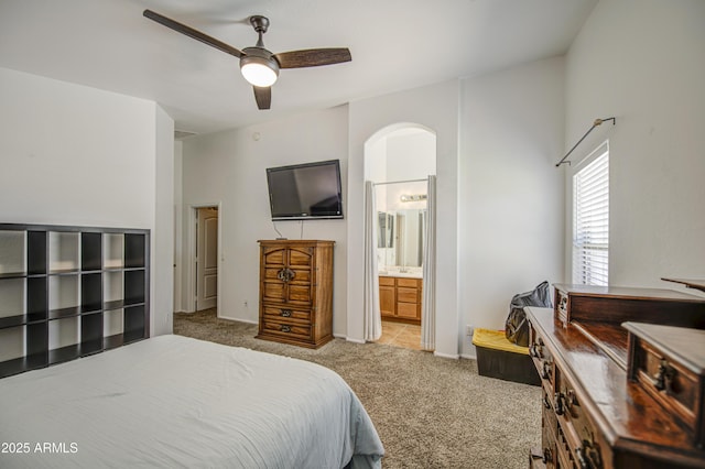 4369 E Coal St, San Tan Valley, AZ 85143 - carpeted bedroom with arched walkways, ceiling fan, and ensuite bath