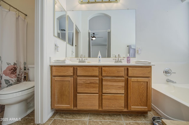 4369 E Coal St, San Tan Valley, AZ 85143 - full bathroom featuring a garden tub, double vanity, ceiling fan, and tile patterned floors