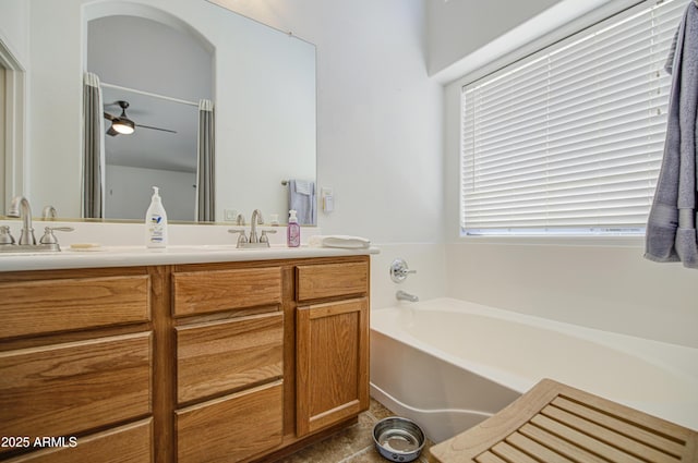 4369 E Coal St, San Tan Valley, AZ 85143 - full bath with double vanity, a garden tub, ceiling fan, and tile patterned floors