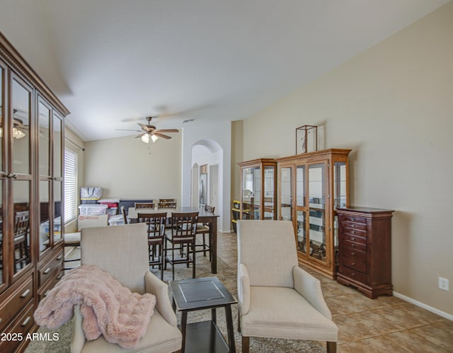 4369 E Coal St, San Tan Valley, AZ 85143 - living room with arched walkways, ceiling fan, and light tile patterned flooring