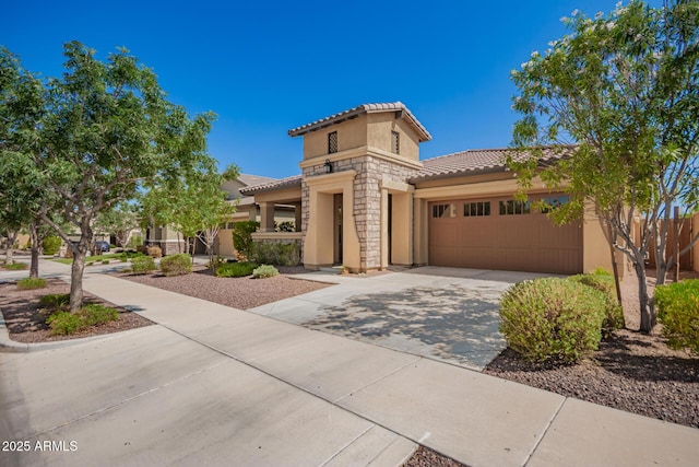 20499 W Alsap Rd, Buckeye, AZ 85396 - mediterranean / spanish-style home with a tiled roof, stucco siding, stone siding, a garage, and driveway