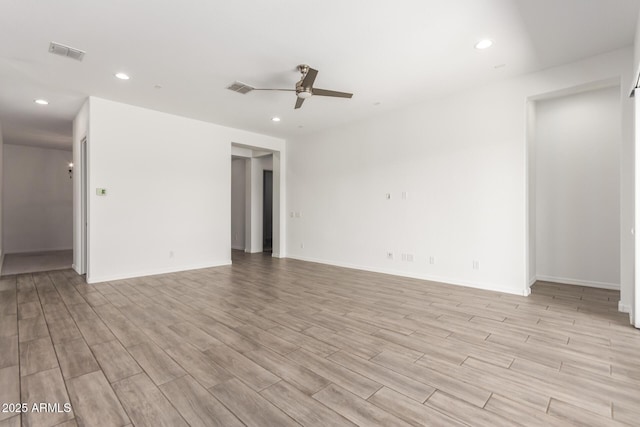 20499 W Alsap Rd, Buckeye, AZ 85396 - spare room with a ceiling fan, light wood finished floors, recessed lighting, and baseboards