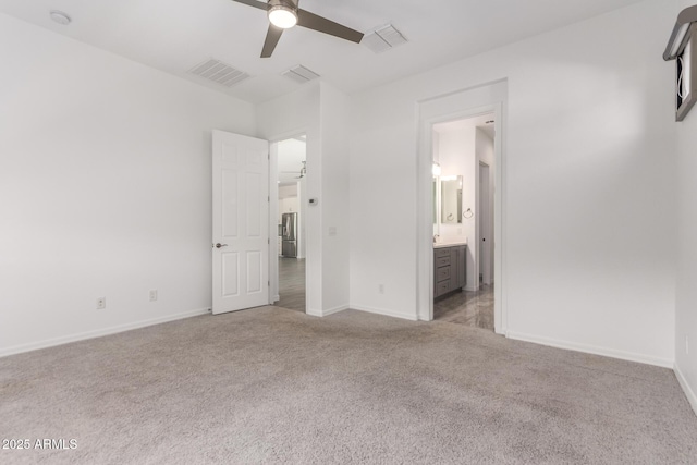 20499 W Alsap Rd, Buckeye, AZ 85396 - unfurnished bedroom featuring light colored carpet, baseboards, ensuite bath, and ceiling fan