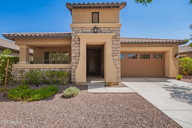 20499 W Alsap Rd, Buckeye, AZ 85396 - view of front of property with stucco siding, a garage, concrete driveway, a tile roof, and stone siding