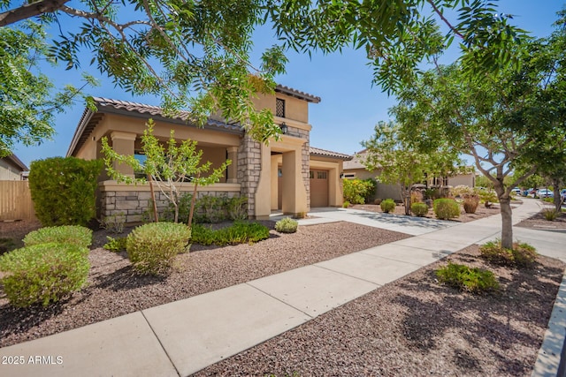 20499 W Alsap Rd, Buckeye, AZ 85396 - mediterranean / spanish-style home featuring a tiled roof, stucco siding, concrete driveway, and a garage