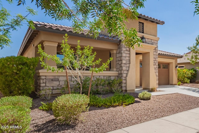 20499 W Alsap Rd, Buckeye, AZ 85396 - mediterranean / spanish house featuring a tile roof, stucco siding, concrete driveway, and a garage