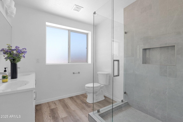 29835 N 56th St N, Cave Creek, AZ 85331 - bathroom with a shower stall, toilet, wood finished floors, double vanity, and baseboards