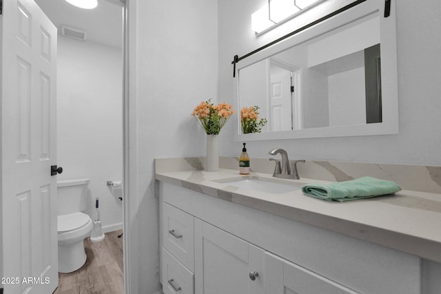 29835 N 56th St N, Cave Creek, AZ 85331 - bathroom with toilet, vanity, and wood finished floors