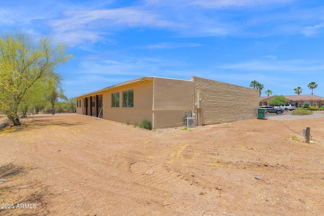 29835 N 56th St N, Cave Creek, AZ 85331 - view of property exterior featuring brick siding and central air condition unit
