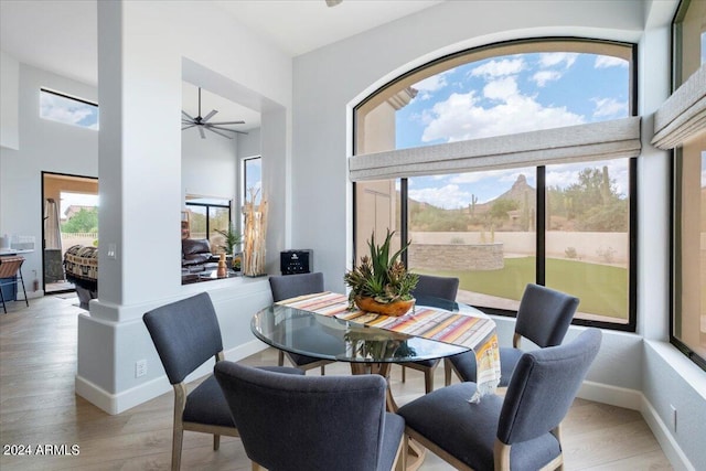 dining space featuring light wood-type flooring and ceiling fan