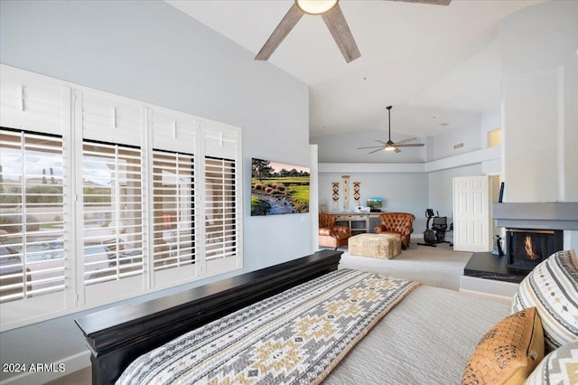 bedroom featuring ceiling fan, lofted ceiling, and carpet flooring