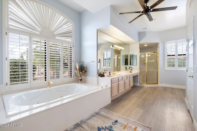 bathroom featuring ceiling fan, vanity, shower with separate bathtub, and plenty of natural light