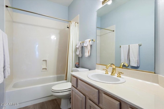 full bathroom featuring vanity, toilet, shower / bathtub combination with curtain, and hardwood / wood-style flooring