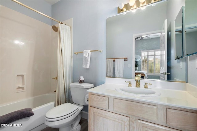 full bathroom featuring vanity, shower / tub combo, and toilet