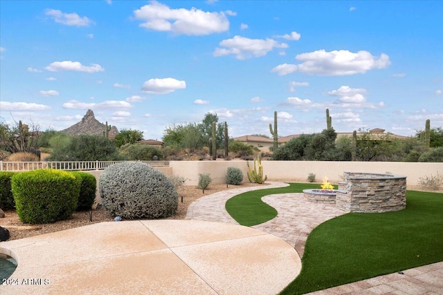 view of patio / terrace with an outdoor fire pit