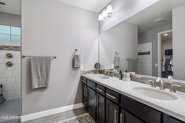 10702 E Sheffield Dr, Mesa, AZ 85212 - bathroom featuring vanity, wood-type flooring, and a tile shower