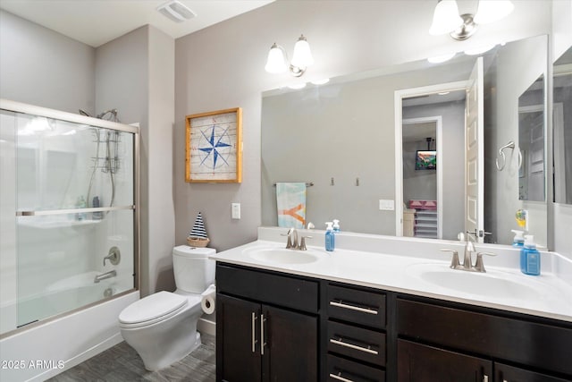 10702 E Sheffield Dr, Mesa, AZ 85212 - full bathroom featuring vanity, combined bath / shower with glass door, and toilet
