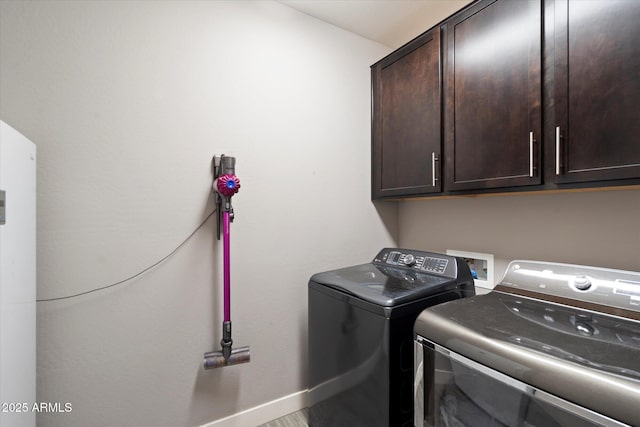 10702 E Sheffield Dr, Mesa, AZ 85212 - clothes washing area with cabinets and washing machine and clothes dryer