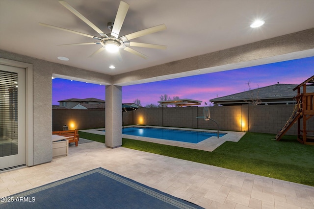 10702 E Sheffield Dr, Mesa, AZ 85212 - pool at dusk with a playground, a patio, and ceiling fan