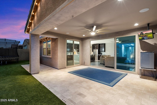 10702 E Sheffield Dr, Mesa, AZ 85212 - patio terrace at dusk with ceiling fan