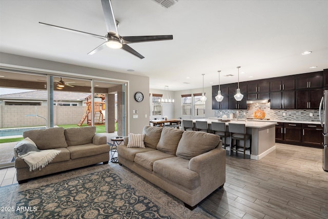10702 E Sheffield Dr, Mesa, AZ 85212 - living room with ceiling fan and light wood-type flooring