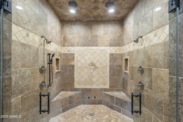 bathroom featuring recessed lighting and a shower stall