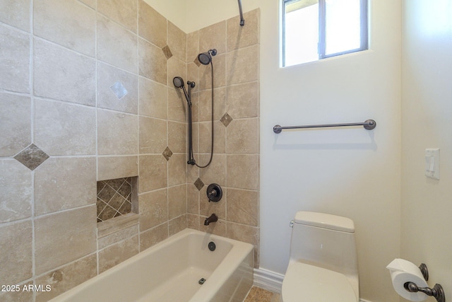 bathroom with toilet and washtub / shower combination