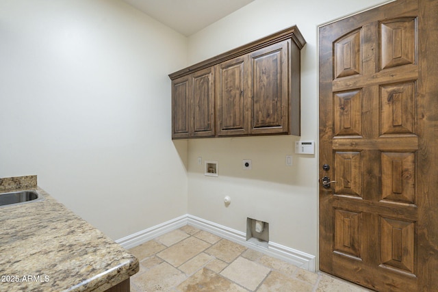 laundry area featuring cabinet space, baseboards, gas dryer hookup, hookup for an electric dryer, and washer hookup