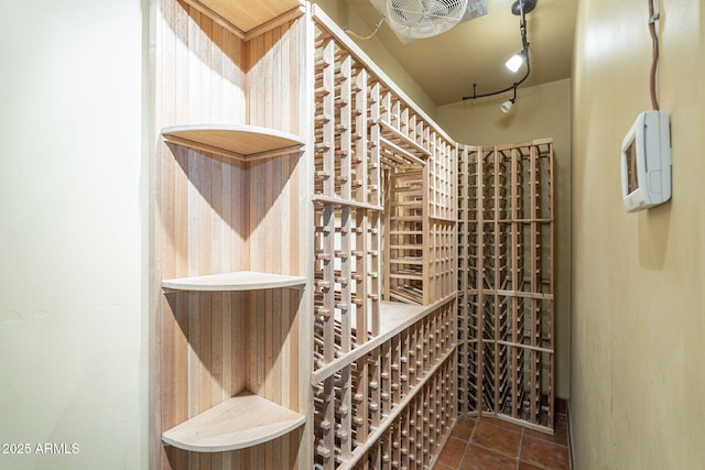 wine cellar featuring visible vents, track lighting, and tile patterned floors