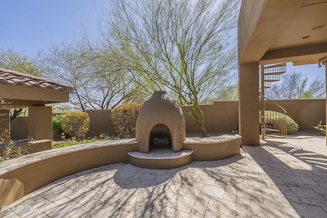 view of patio featuring fence