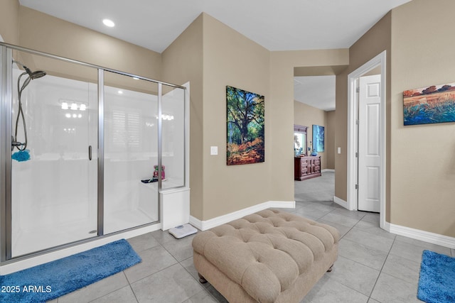 bathroom featuring walk in shower and tile patterned flooring