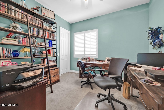 office area featuring light carpet