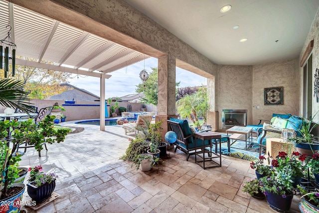 view of patio featuring outdoor lounge area, a pool with hot tub, and a pergola