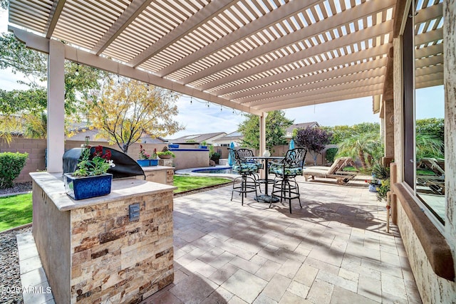 view of patio / terrace with a pergola and area for grilling