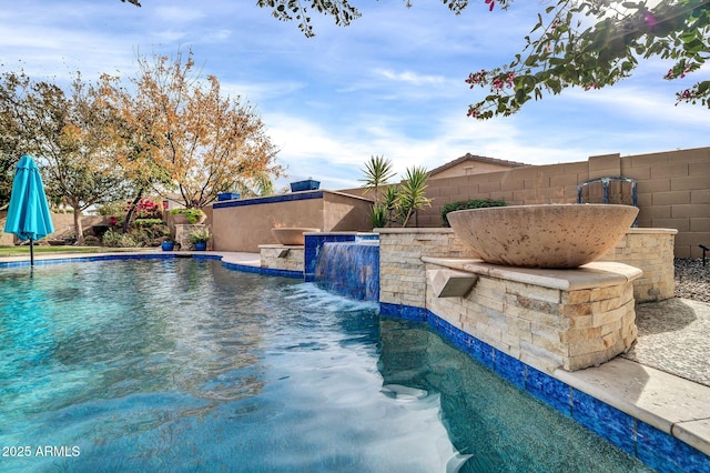 view of pool with pool water feature