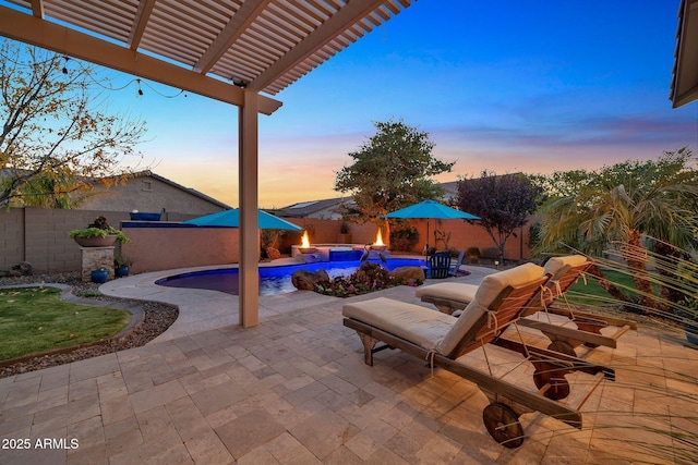 patio terrace at dusk featuring a pergola and a fenced in pool